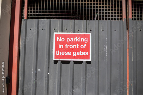 No Parking Sign on Metal Gate