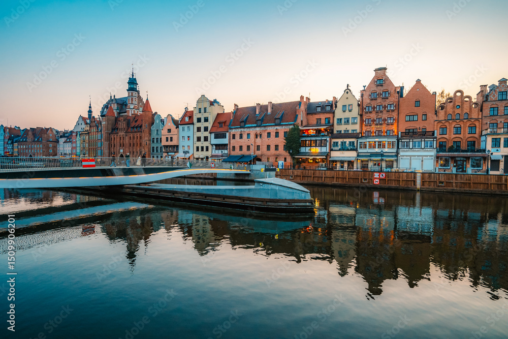 Obraz premium Gdansk with Motlawa river in Poland. Old town colourful house with Holy Spirit Gate