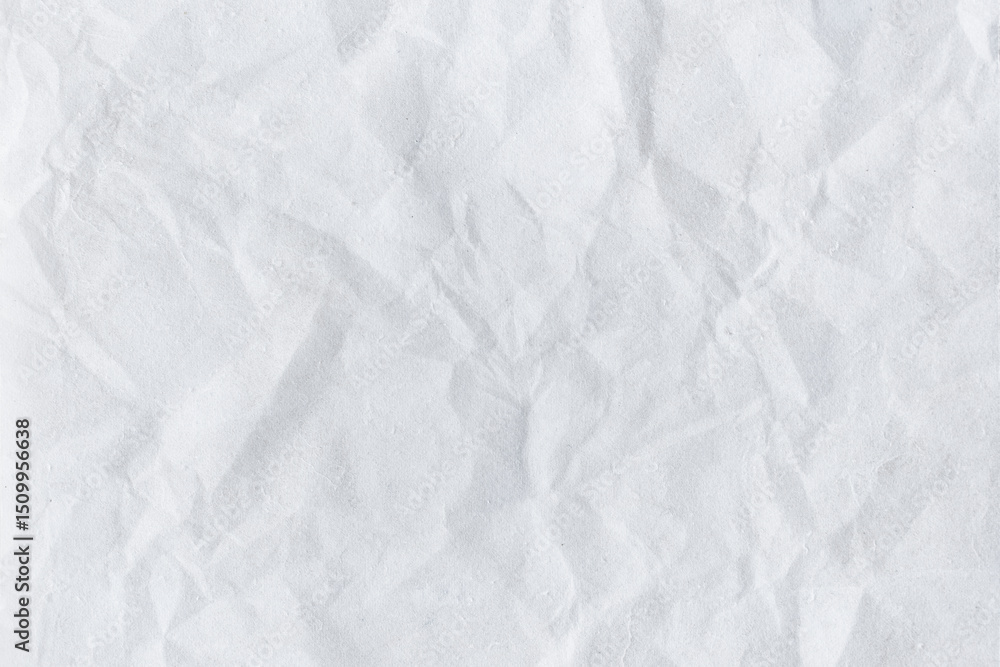 Crumpled white paper with rough textured surface and blank sheet background