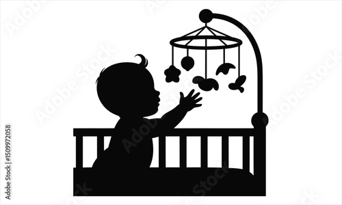 Baby reaching for mobile in crib silhouette