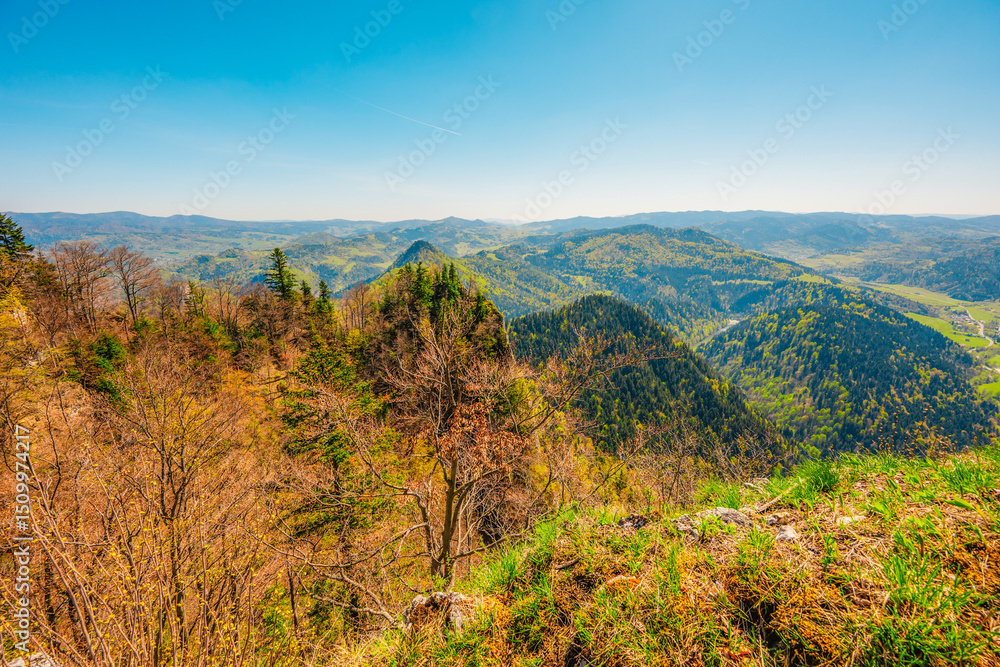 Naklejka premium Hiking to peak Tri Koruny or Trzy Korony during day. Pieniny National park in Poland. View from the lookout at the top.