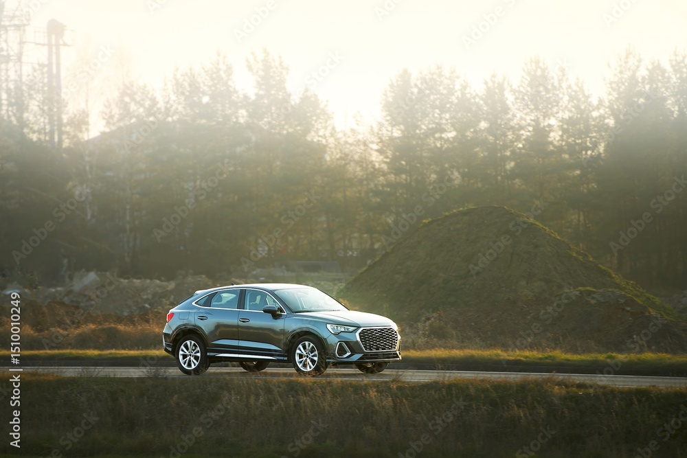 Fototapeta premium Modern family wagon on countryside drive