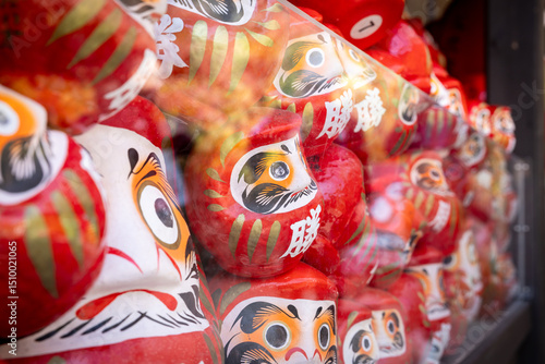 Osaka, Japan - December 2024: Scenic view of Katsuoji Temple in Minoh during peak autumn season. Beautifully framed by vibrant red and orange maple leaves, reflecting the serene atmosphere of autumn.