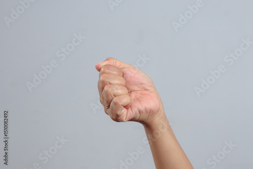 Closed fist hand gesture used to express strength unity power and resolve
