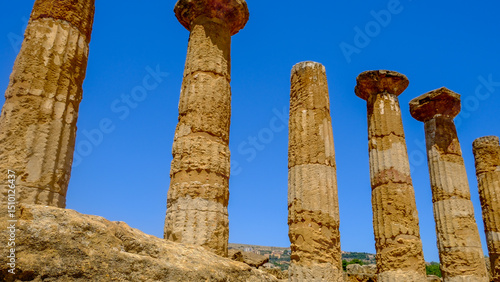 Ancient Greek Columns in Sicily’s Valley of the Temples – Dramatic Low Angle View of Historic Ruins Against Deep Blue Sky, Timeless Travel Destination and Mediterranean Cultural Heritage