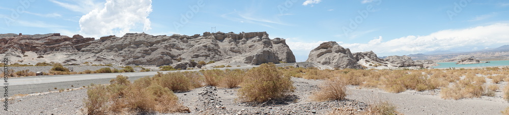 Panorama of street, rocks and lake in Andes desert, San Juan province, Argentina. Panorama of street, rocks and lake in Andes desert, San Juan province, Argentina.