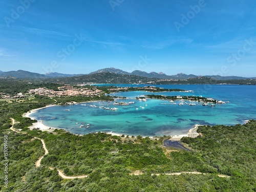 Fototapeta Naklejka Na Ścianę i Meble -  Aerial view of a white sand beach bathed by a beautiful turquoise sea. Marinella Beach, Porto Rotondo, Costa Smeralda, Sardinia, Italy