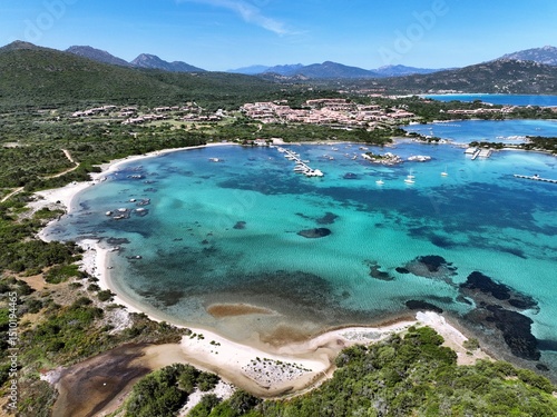 Fototapeta Naklejka Na Ścianę i Meble -  Aerial view of a white sand beach bathed by a beautiful turquoise sea. Marinella Beach, Porto Rotondo, Costa Smeralda, Sardinia, Italy