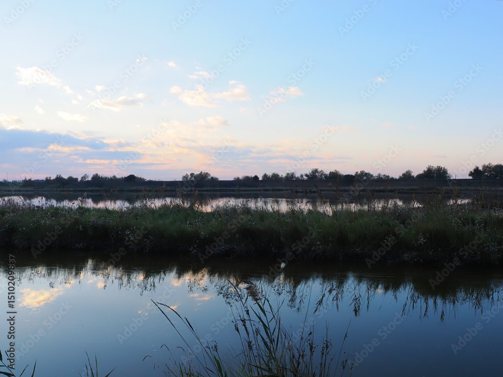 Fototapeta premium Location Volano, in the province of Ferrara. Po Delta, Po Valley, Northern Italy. Late afternoon with a view of the valleys.