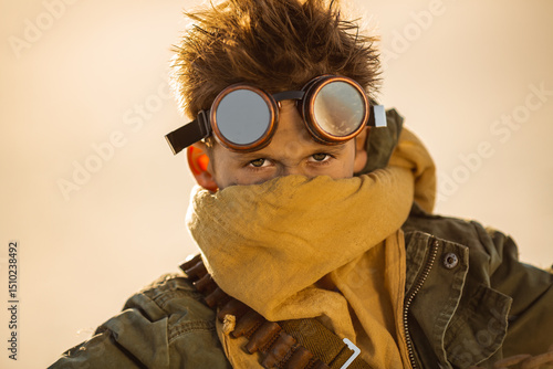 Obraz na plátně Post-Apocalyptic Warrior Boy With Goggles And Scarf In Desert Setting
