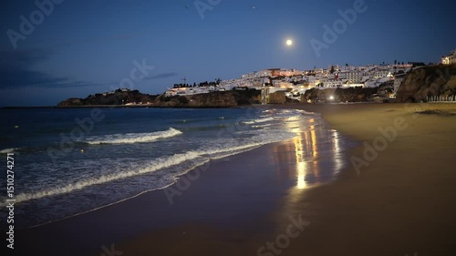 Moonlit Albufeira Beach: Coastal Paradise Under Night Sky