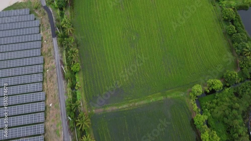 4K Aerial View of Industrial Factory with Solar Panels on Roof Producing Clean Energy