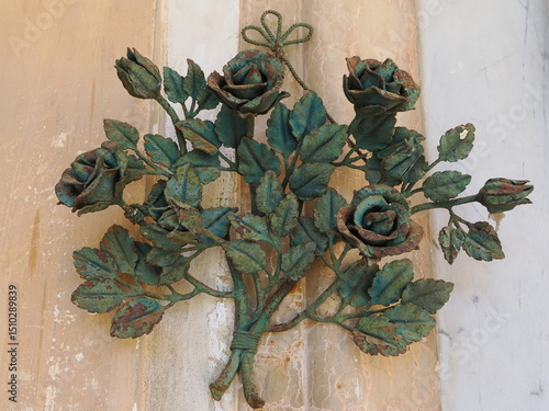 Old bouquet of flowers made of rusty iron.