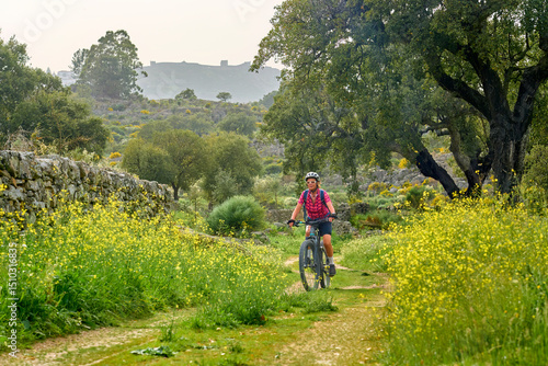 active senior woman cycling...