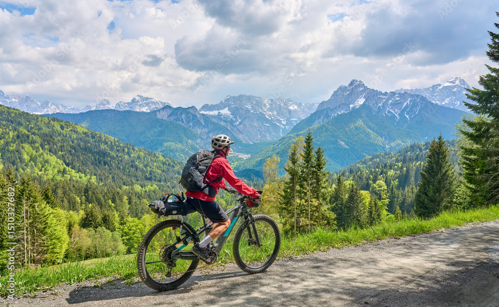 active senior woman on a mountain bike tour in the Julian Alps above Kranska Gora in Slovenia
active senior woman on a mountain bike tour in the Julian Alps above Kranska Gora in Slovenia