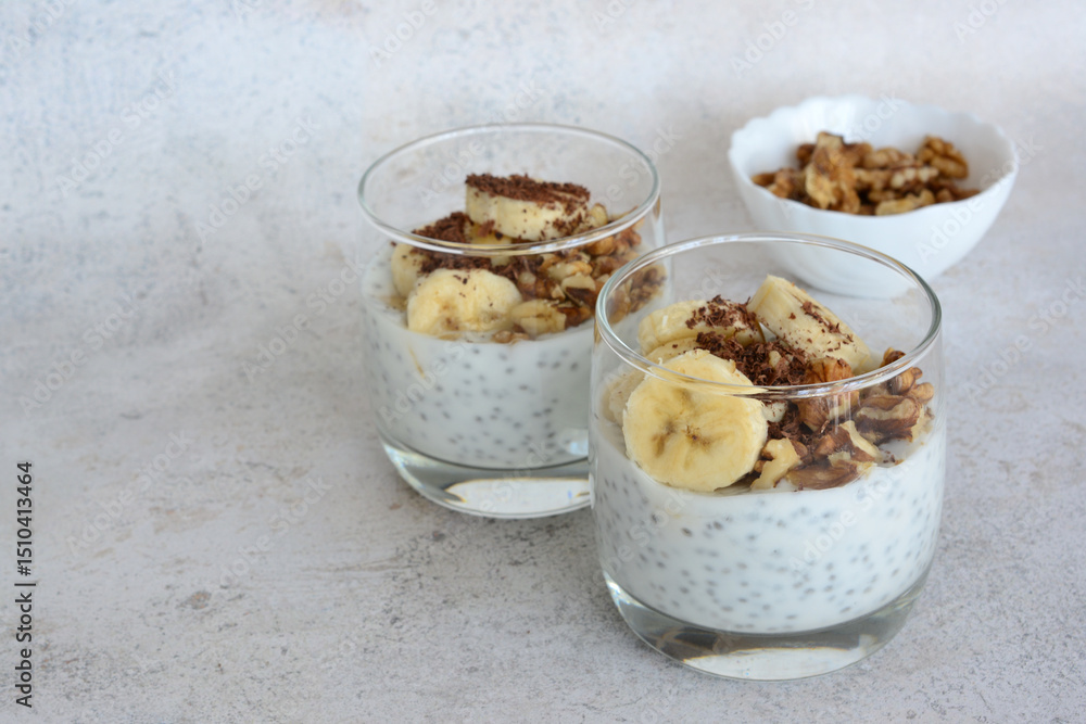 Chia Seed Pudding with Banana and Granola and walnut in Glass Chia Seed Pudding with Banana and Granola and walnut in Glass