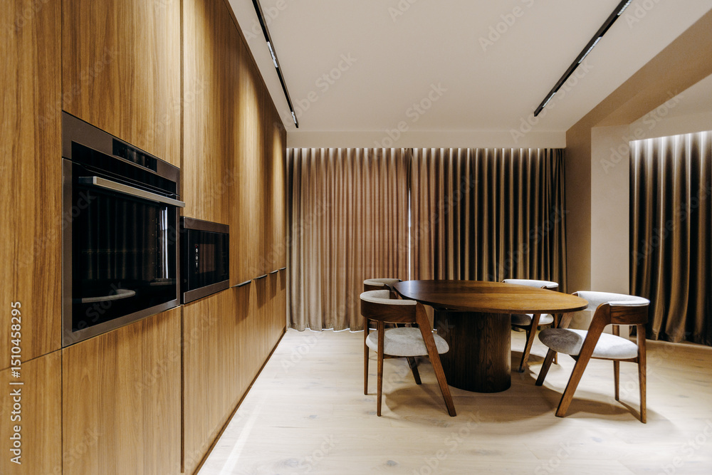 A cozy dining room with a wooden table, matching chairs, and curtains A cozy dining room with a wooden table, matching chairs, and curtains