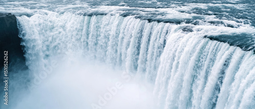 Roaring waterfall cascading down cliffs, Majestic waterfall cascading into a serene pool, surrounded by mist and natural beauty, capturing the essence of nature's power.