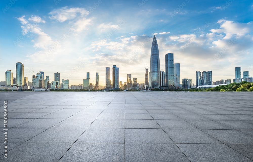 Empty square floor and city skyline with modern buildings at sunset in Shenzhen, China. Empty square floor and city skyline with modern buildings at sunset in Shenzhen, China.