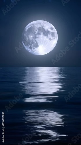 : Full moon reflecting on a calm sea in vertical format.