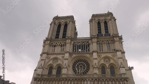 View on the medieval Catholic cathedral church Notre-Dame de Paris in French Gothic style at the Place Jean-Paul II on the island Ile de la Cite, 4th arrondissement of Paris, France.