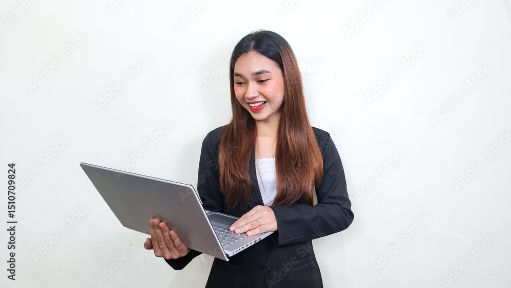 Beautiful and successful asian business woman. Office woman in black suit looking at laptop with happy smile. Advertising marketing concept. knowledgeforall. Beautiful and successful asian business woman. Office woman in black suit looking at laptop with happy smile. Advertising marketing concept. knowledgeforall.
