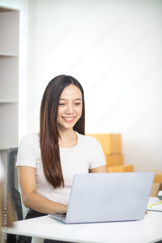 Beautiful Asian business woman starting her SME business using her home as an office or Home Office to save on start up costs. Portrait start up SME business Asian business woman inside Home Office Beautiful Asian business woman starting her SME business using her home as an office or Home Office to save on start up costs. Portrait start up SME business Asian business woman inside Home Office