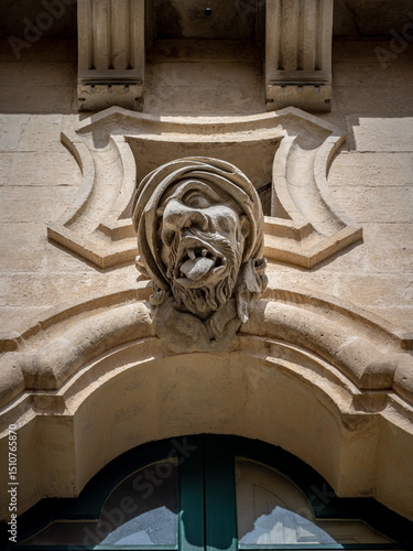 The beggar head on Bertini Palace, in Ragusa, Sicily, Italy