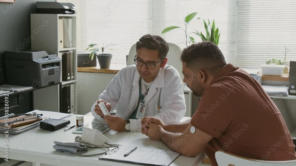 custom made wallpaper toronto digitalMale patient with glucose monitoring system patch on arm sitting in front of confident doctor presenting him new medication and listening to medical recommendations