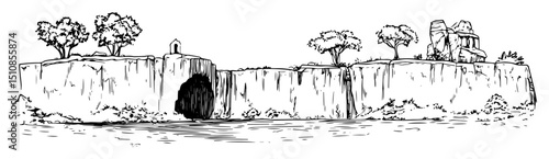 rocky cliff with carved tombs and sparse trees