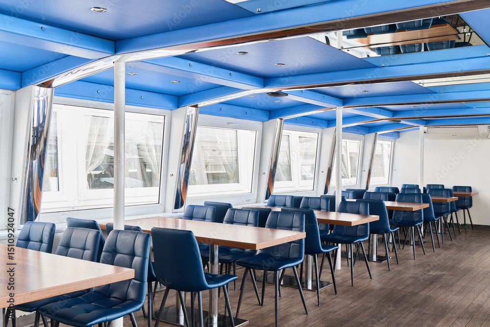 A modern bluethemed dining area with stylish tables and comfortable chairs, perfect for gatherings A modern bluethemed dining area with stylish tables and comfortable chairs, perfect for gatherings