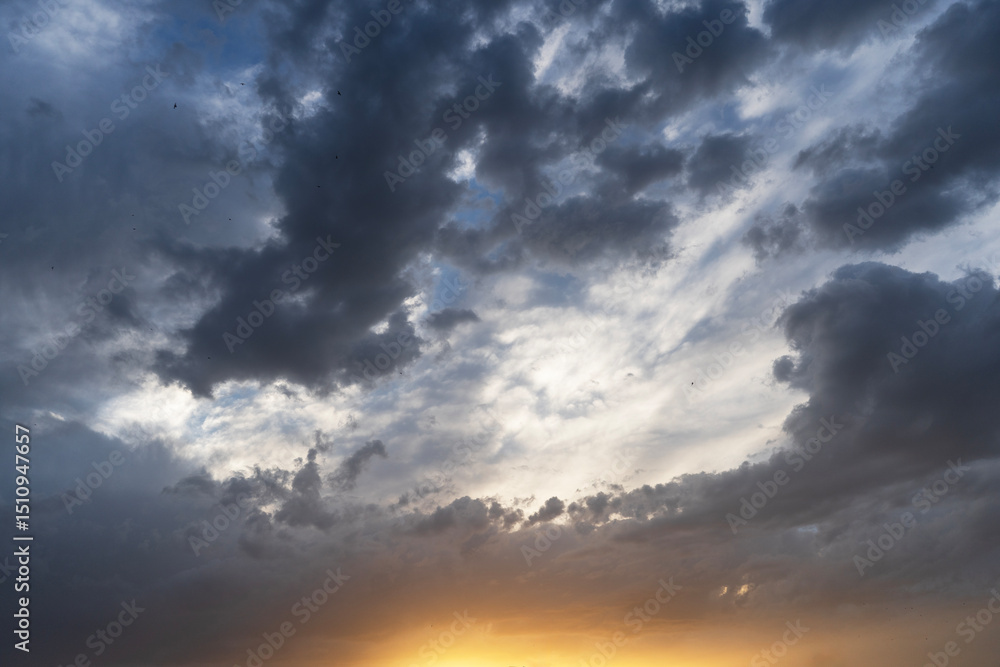 Beautiful bright sunset evening sky with dramatic clouds. Beautiful bright sunset evening sky with dramatic clouds.