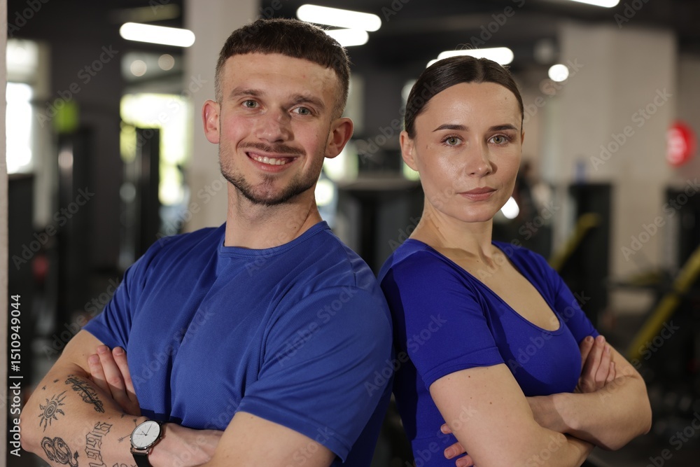 Fototapeta premium Portrait of professional personal trainers in gym
