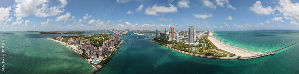 Obraz premium Miami Beach aerial view panorama with skyline. Miami panorama. South Pointe beach with skyscrapers panorama. Miami city panorama. Oceanfront skyline of Miami Beach with blue sky.