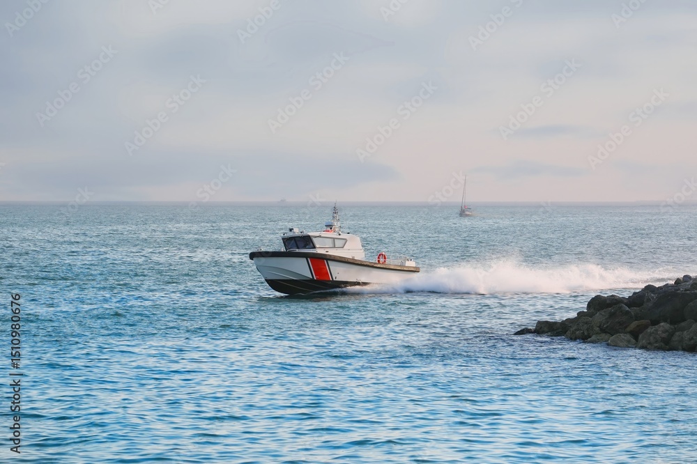 Fototapeta premium Coast guard boat checks coastline
