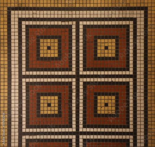 Mosaic floor with multicolored small square tiles with an abstract pattern