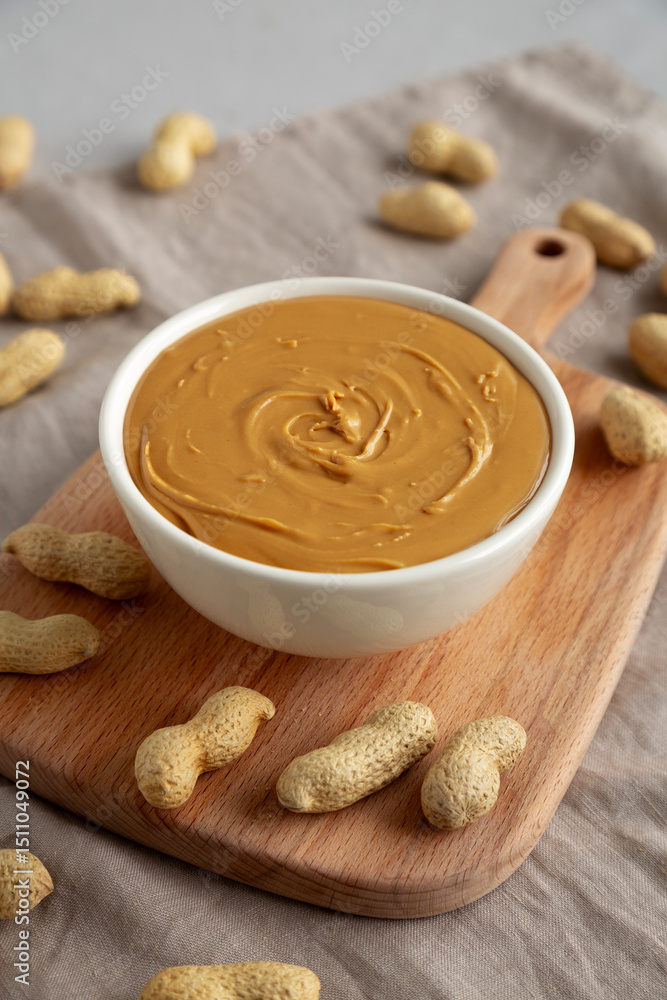 Fototapeta premium Organic Peanut Butter in a Bowl, side view.