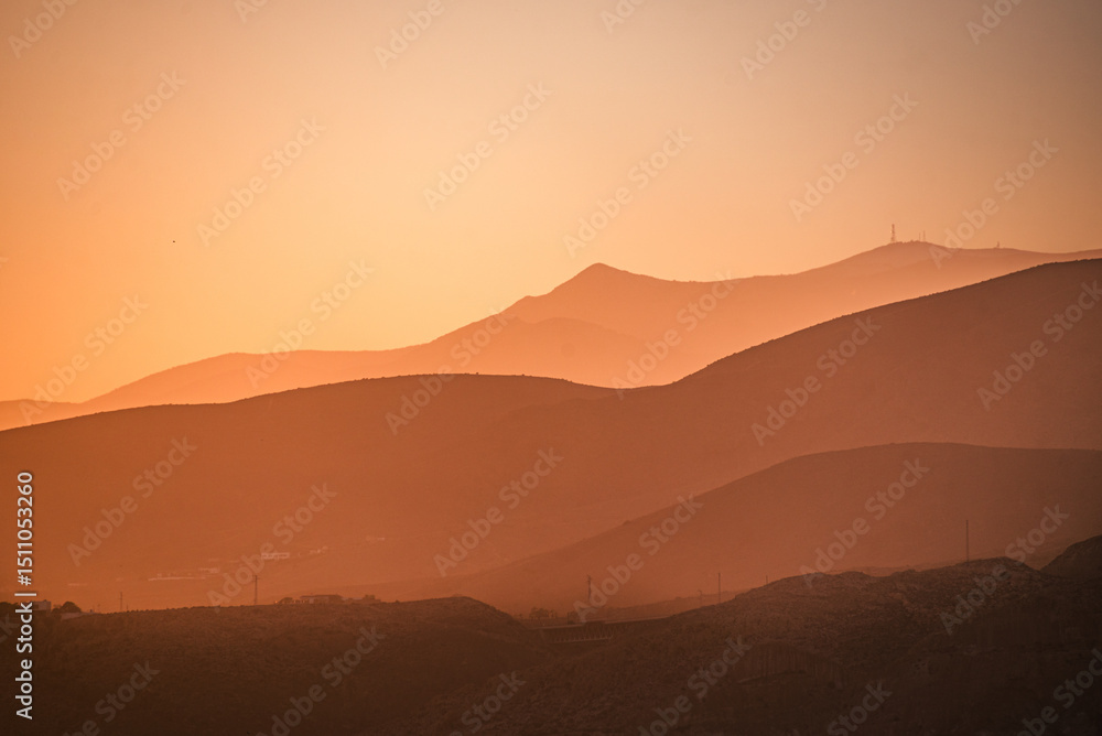 Golden hues blanket the rolling mountains of Almeria, Spain Golden hues blanket the rolling mountains of Almeria, Spain
