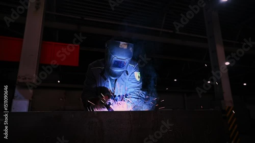 Welding Process in Industrial Setting is characterized by intense Sparks and Smoke