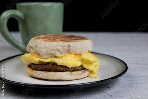 English muffin breakfast sandwich with coffee 