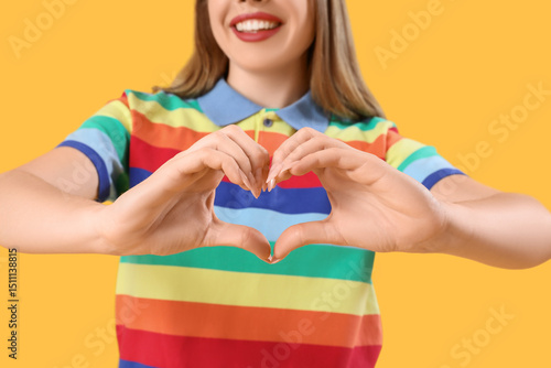 Young woman in rainbow shir...