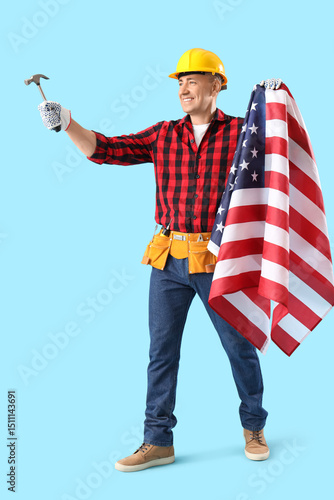 Mature worker with hammer a...