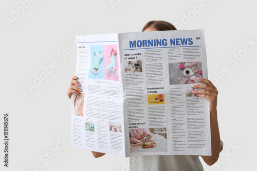 Woman reading morning newsp...