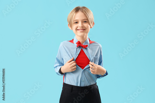 Little actor dressed as sup...