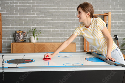 Young woman playing air hoc...