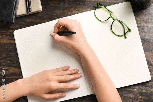 Woman writing something in ...