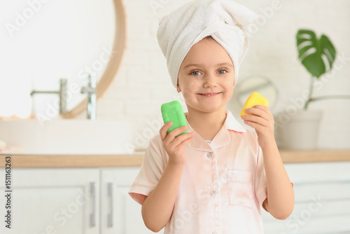 Little girl with soap bars ...
