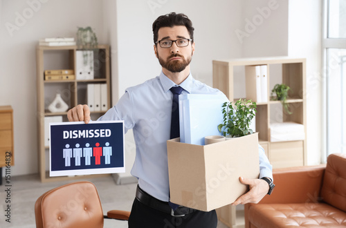 Sad young man holding paper...