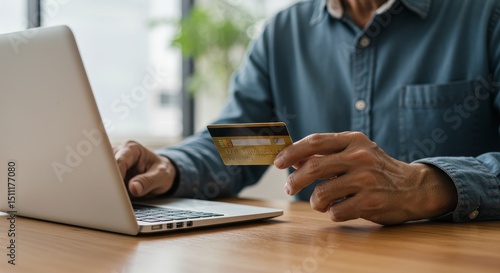 Photo of Man Using Laptop And Credit Card For Online Transaction