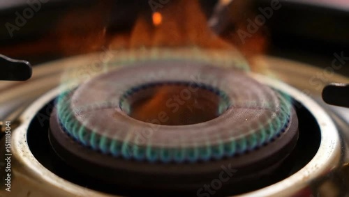 Close-up of a coil burner glowing orange as it heats from cold to full temperature.
